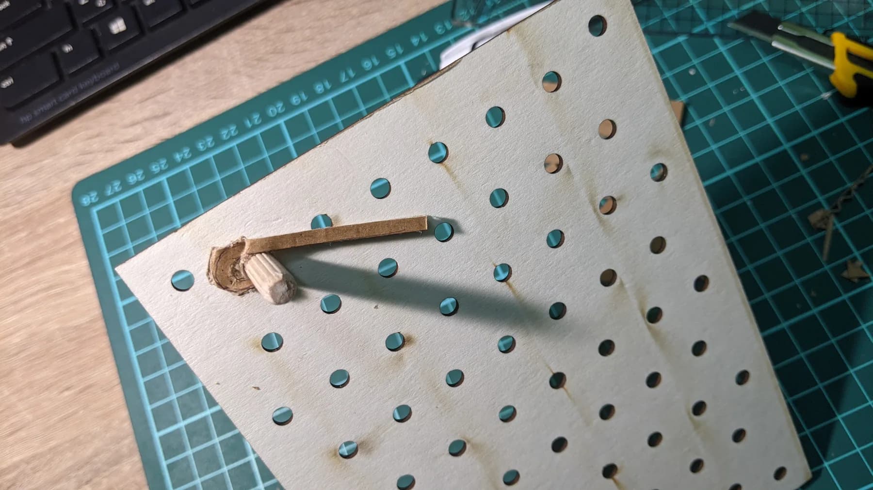 Hands testing an early pin-based maze prototype