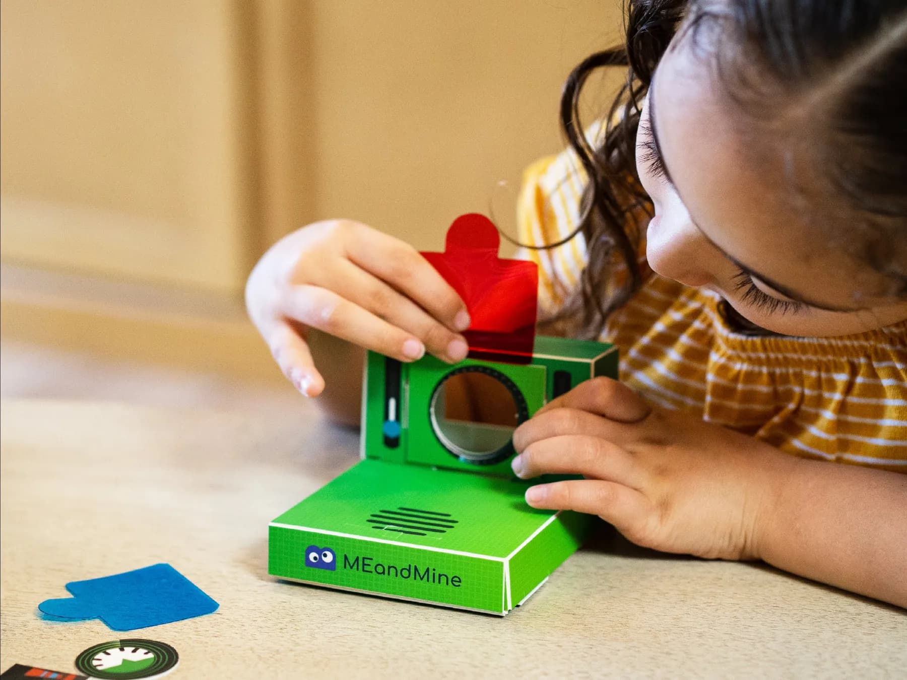 A child looking through the green Memory Camera