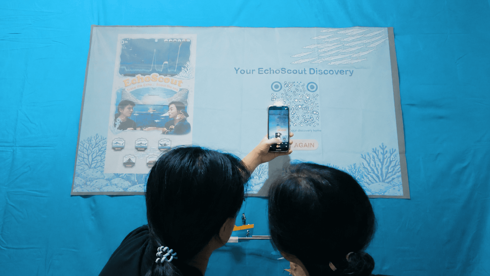 A player photographing their finished EchoScout discovery poster